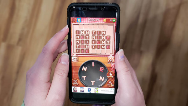 woman-playing-wordgame-app
